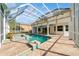 Inviting pool and spa with screened enclosure at 3405 Loggerhead Way, Wesley Chapel, FL 33544