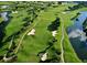 Aerial view of lush green golf course with water features at 3848 Stratfield Dr, New Port Richey, FL 34652