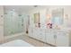 Large bathroom with double vanity, shower, and tub at 4931 61St S Ave, St Petersburg, FL 33715