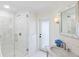 Elegant bathroom with marble shower, modern fixtures, and a large mirror at 4931 61St S Ave, St Petersburg, FL 33715