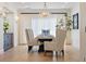 Bright dining room with hardwood floors, large table, and chandelier at 4931 61St S Ave, St Petersburg, FL 33715