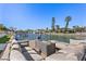 Relaxing waterfront dock with seating and fire pit at 4931 61St S Ave, St Petersburg, FL 33715