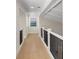 Elegant hallway with hardwood floors and white trim at 4931 61St S Ave, St Petersburg, FL 33715