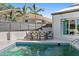 Poolside patio with table and chairs for dining at 4931 61St S Ave, St Petersburg, FL 33715