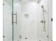 Spacious shower with frameless glass enclosure and multiple shower heads at 4931 61St S Ave, St Petersburg, FL 33715