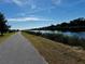 Scenic waterfront path alongside calm water, offering peaceful strolls at 508 Canal Way, Oldsmar, FL 34677