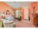 Bright living room with peach walls and patterned sofas at 5935 Precious View Ct, New Port Richey, FL 34655