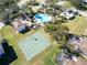 Aerial view of community amenities featuring a pool, basketball court, and well-maintained landscaping at 12432 Country White Cir, Tampa, FL 33635