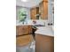 Well-lit kitchen featuring modern appliances, updated cabinetry, and a stylish backsplash at 12432 Country White Cir, Tampa, FL 33635