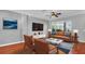 Inviting living room with a large window, hardwood floors, and a comfortable seating arrangement at 12432 Country White Cir, Tampa, FL 33635