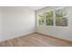 Simple bedroom with large windows and wood flooring at 1712 W Arch St, Tampa, FL 33607