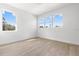 Bright bedroom with hardwood floors and multiple windows at 1712 W Arch St, Tampa, FL 33607