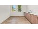 Small kitchen with light wood cabinets and quartz countertops at 1712 W Arch St, Tampa, FL 33607