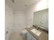 Main bathroom with a tub, toilet and single vanity at 7002 Ripple Pond Loop, Zephyrhills, FL 33541