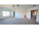 Spacious bedroom with plush carpet and ensuite bathroom access at 7002 Ripple Pond Loop, Zephyrhills, FL 33541