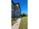 Home's exterior showcases a walkway and landscaping at 7002 Ripple Pond Loop, Zephyrhills, FL 33541