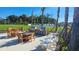 Outdoor kitchen area with grills and seating for entertaining at 7002 Ripple Pond Loop, Zephyrhills, FL 33541