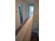 Upstairs hallway with carpet and access to bedrooms and bathrooms at 7002 Ripple Pond Loop, Zephyrhills, FL 33541