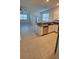 Modern kitchen featuring granite countertops and stainless steel appliances at 7002 Ripple Pond Loop, Zephyrhills, FL 33541