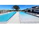 Resort-style pool with plenty of lounge chairs at 7002 Ripple Pond Loop, Zephyrhills, FL 33541