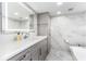 Elegant bathroom with marble tile and modern vanity at 1390 Gulf Blvd # 1204, Clearwater, FL 33767