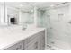 Modern bathroom with gray vanity, quartz countertop, and a glass shower at 1390 Gulf Blvd # 1204, Clearwater, FL 33767