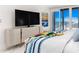 Main bedroom with ocean view and stylish furnishings at 1390 Gulf Blvd # 1204, Clearwater, FL 33767