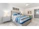 Spacious bedroom with white walls and coastal decor at 1390 Gulf Blvd # 1204, Clearwater, FL 33767
