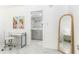 Home office space with a desk, chair, artwork, and a view of the bathroom at 1390 Gulf Blvd # 1204, Clearwater, FL 33767