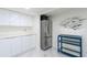 Laundry room with washer, dryer, and extra storage at 1390 Gulf Blvd # 1204, Clearwater, FL 33767