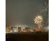Night time view of city skyline with fireworks display at 1390 Gulf Blvd # 1204, Clearwater, FL 33767