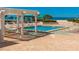 Relaxing pool area with pergola and ocean view at 1390 Gulf Blvd # 1204, Clearwater, FL 33767