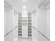 Large walk-in closet featuring ample hanging space and shelving at 1390 Gulf Blvd # 1204, Clearwater, FL 33767