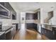 Stylish kitchen featuring modern stainless appliances and dark cabinets at 609 N Bradford Ave, Tampa, FL 33609