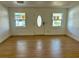 Bright living room with new wood-look flooring at 3201 W Delaware Ave, Plant City, FL 33563