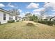 Wide backyard with a well maintained lawn and sparse landscape at 7231 Big Bend Dr, Spring Hill, FL 34606