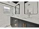Bathroom featuring a double vanity with dark wood cabinetry, white countertop, and a glass shower at 7231 Big Bend Dr, Spring Hill, FL 34606