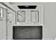Bathroom featuring a double vanity with dark wood cabinetry and a glass enclosed shower at 7231 Big Bend Dr, Spring Hill, FL 34606