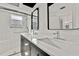 Bathroom featuring a double vanity with dark wood cabinetry, white countertop, and a glass shower at 7231 Big Bend Dr, Spring Hill, FL 34606