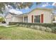 Charming single-story home with a well-maintained lawn and complementary landscape at 7231 Big Bend Dr, Spring Hill, FL 34606