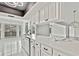 Bright kitchen with modern appliances and stainless steel dishwasher at 7231 Big Bend Dr, Spring Hill, FL 34606