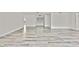 Expansive living space with modern flooring and white walls, offering versatile design possibilities at 7231 Big Bend Dr, Spring Hill, FL 34606