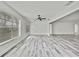 Spacious living room offers natural light and modern floors at 7231 Big Bend Dr, Spring Hill, FL 34606