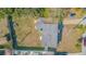 Overhead view of house, yard, and neighboring properties at 9696 Groveland St, Seminole, FL 33772