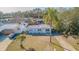 House with a large yard and palm trees visible at 9696 Groveland St, Seminole, FL 33772