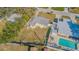 High-angle view showcasing house, yard, and pool at 9696 Groveland St, Seminole, FL 33772