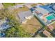 Aerial view showing house, pool, and large backyard at 9696 Groveland St, Seminole, FL 33772