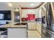 Modern kitchen with granite countertops and stainless steel appliances at 9696 Groveland St, Seminole, FL 33772
