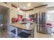 Modern kitchen featuring granite island and stainless steel appliances at 9696 Groveland St, Seminole, FL 33772