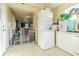 Small laundry room with stackable washer and dryer at 9696 Groveland St, Seminole, FL 33772